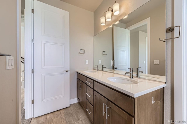 9436 E 57h Ave, Denver, CO 80238 - bathroom featuring double vanity and baseboards