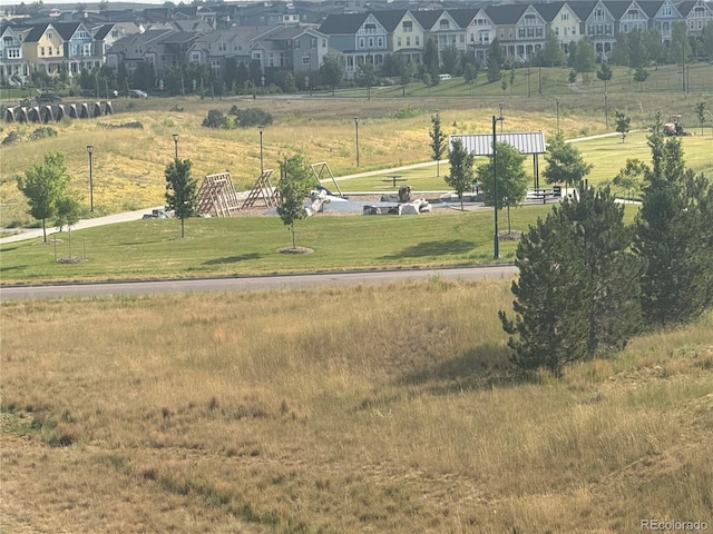 9436 E 57h Ave, Denver, CO 80238 - surrounding community featuring a residential view and a yard