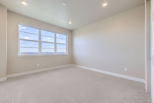 9436 E 57h Ave, Denver, CO 80238 - empty room with light colored carpet and recessed lighting
