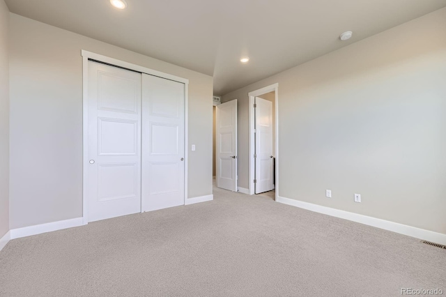 9436 E 57h Ave, Denver, CO 80238 - unfurnished bedroom with light carpet, recessed lighting, and a closet