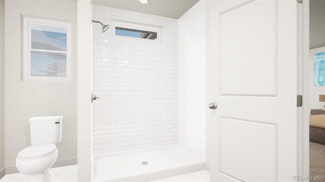 46545 Sunflower Ln, Bennett, CO 80102 - bathroom featuring a tile shower and toilet