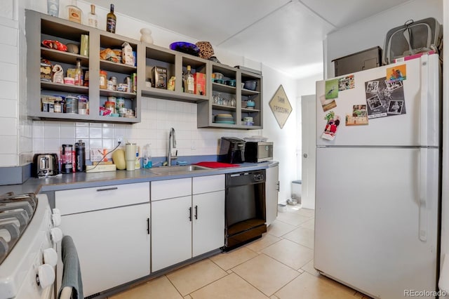 3000 S Sherman St, Englewood, CO 80113 - kitchen featuring freestanding refrigerator, dishwasher, a sink, range, and tasteful backsplash