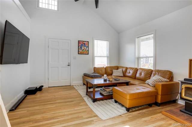 3000 S Sherman St, Englewood, CO 80113 - living area featuring plenty of natural light, light wood-style flooring, high vaulted ceiling, baseboards, and ceiling fan