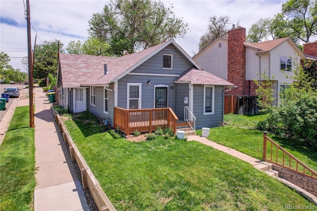 3000 S Sherman St, Englewood, CO 80113 - bungalow-style house featuring a deck and roof with shingles