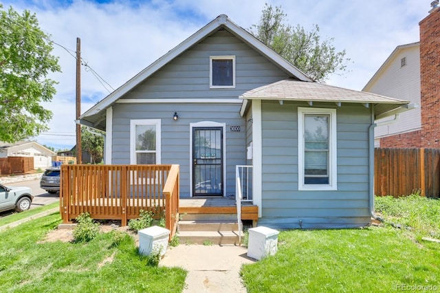 3000 S Sherman St, Englewood, CO 80113 - bungalow-style home with a wooden deck and a shingled roof