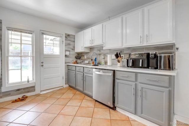 3000 S Sherman St, Englewood, CO 80113 - kitchen featuring stainless steel dishwasher, gray cabinets, healthy amount of natural light, and a sink