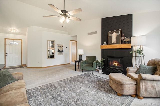 2045 Parkwood Dr, Johnstown, CO 80534 - living room featuring a large fireplace, carpet floors, ceiling fan, lofted ceiling, and baseboards