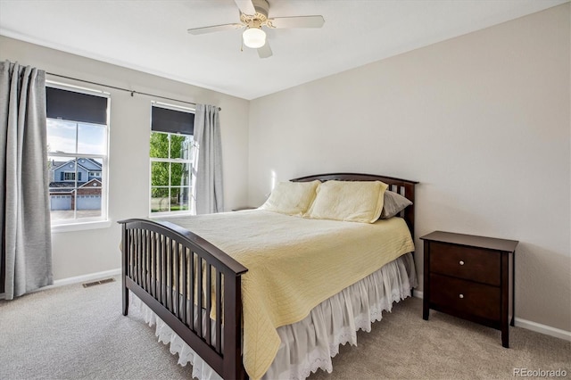 bedroom with carpet flooring, baseboards, and ceiling fan