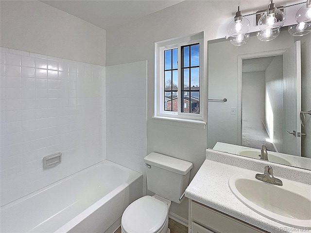 full bathroom with vanity, bathtub / shower combination, and toilet