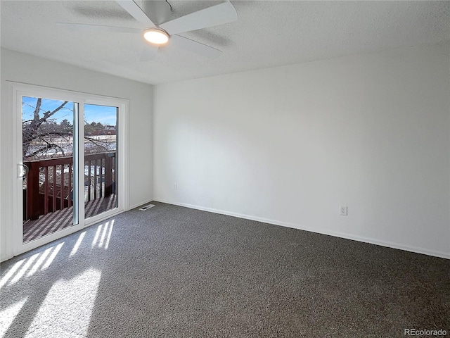 empty room featuring ceiling fan and a textured ceiling