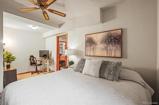 carpeted bedroom featuring baseboards and a ceiling fan