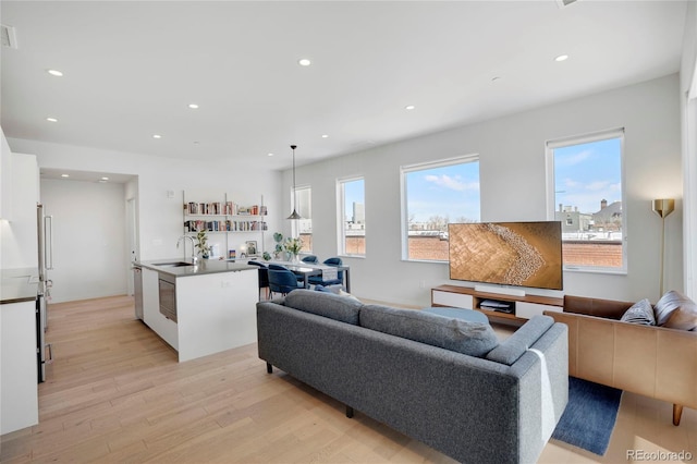 1300 N Ogden St Unit 304, Denver, CO 80218 - living room with light wood-type flooring and recessed lighting