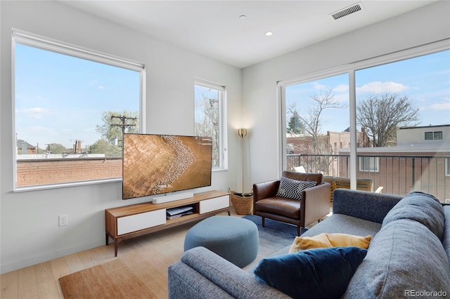 1300 N Ogden St Unit 304, Denver, CO 80218 - living area featuring wood finished floors and recessed lighting