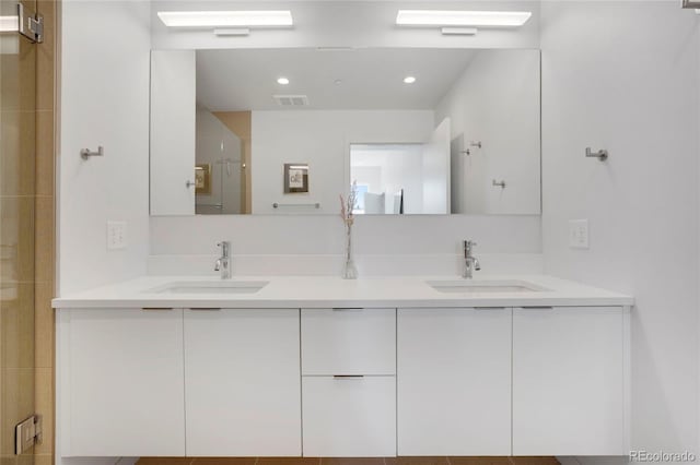 1300 N Ogden St Unit 304, Denver, CO 80218 - bathroom featuring double vanity, an enclosed shower, and recessed lighting