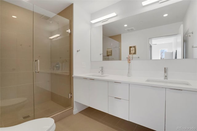 1300 N Ogden St Unit 304, Denver, CO 80218 - full bathroom featuring a shower stall, double vanity, toilet, tile patterned floors, and recessed lighting