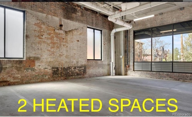 1300 N Ogden St Unit 304, Denver, CO 80218 - empty room featuring brick wall