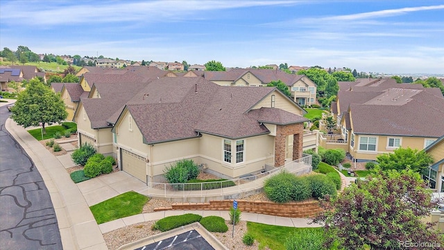 22124 E Euclid Dr, Aurora, CO 80016 - view of front of home with a residential view, stucco siding, and a shingled roof