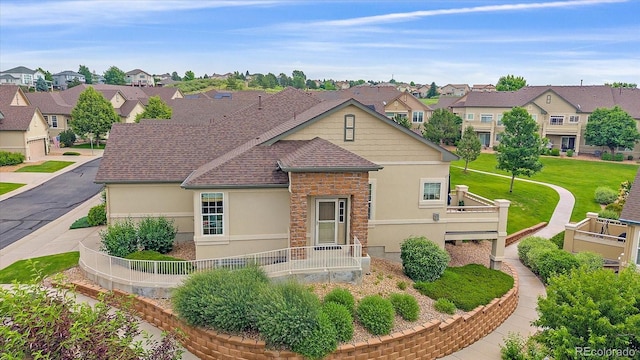 22124 E Euclid Dr, Aurora, CO 80016 - view of front facade with stucco siding, a residential view, and stone siding