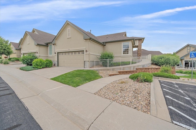 22124 E Euclid Dr, Aurora, CO 80016 - view of front of property with stucco siding and concrete driveway