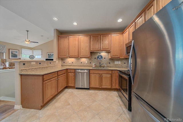 22124 E Euclid Dr, Aurora, CO 80016 - kitchen featuring appliances with stainless steel finishes, a peninsula, backsplash, a ceiling fan, and light stone counters