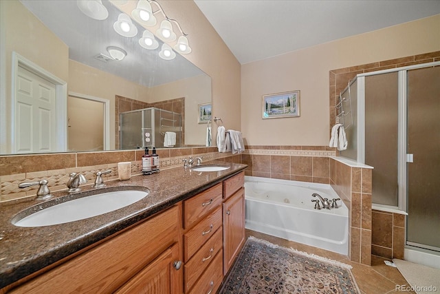 22124 E Euclid Dr, Aurora, CO 80016 - bathroom with a stall shower, double vanity, a jetted tub, and tile patterned floors