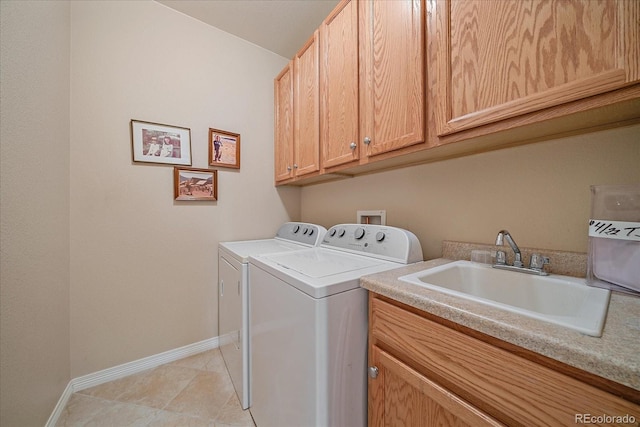 22124 E Euclid Dr, Aurora, CO 80016 - washroom with separate washer and dryer, cabinet space, and light tile patterned floors