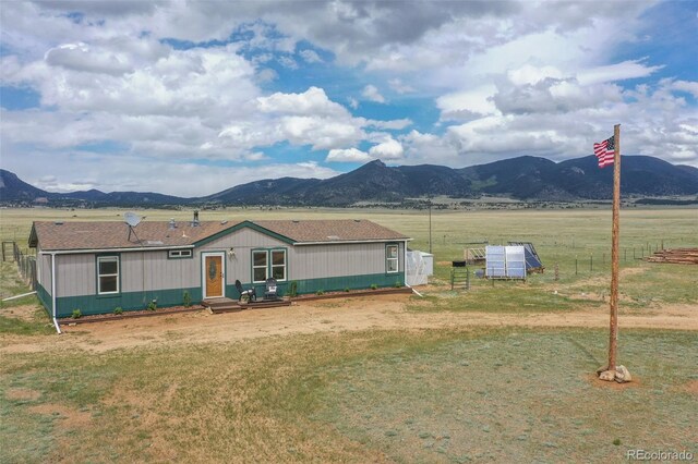 463 Snowshoe Ln, Lake George, CO 80827 - view of front facade featuring a mountain view and a front lawn