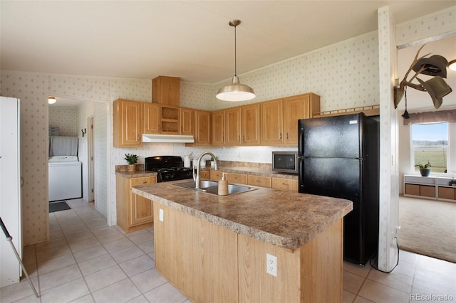 463 Snowshoe Ln, Lake George, CO 80827 - kitchen featuring washer / dryer, black appliances, wallpapered walls, a sink, and light tile patterned floors