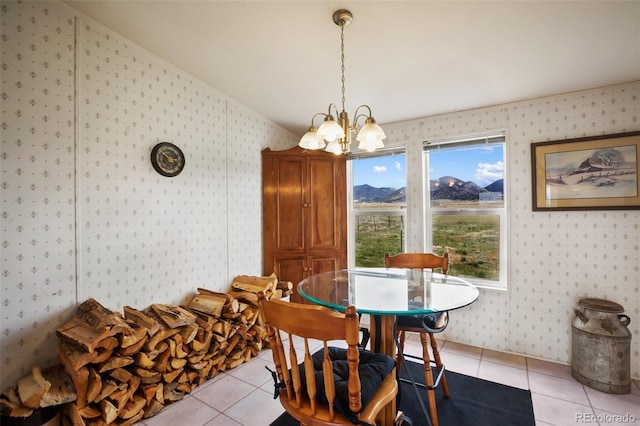 463 Snowshoe Ln, Lake George, CO 80827 - dining room featuring wallpapered walls, light tile patterned floors, a chandelier, and vaulted ceiling