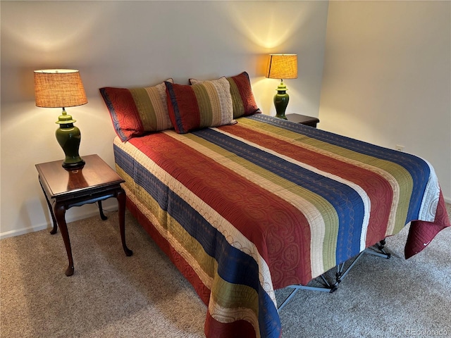 carpeted bedroom with baseboards