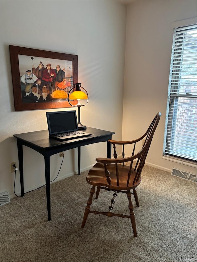 office featuring visible vents, baseboards, and carpet floors