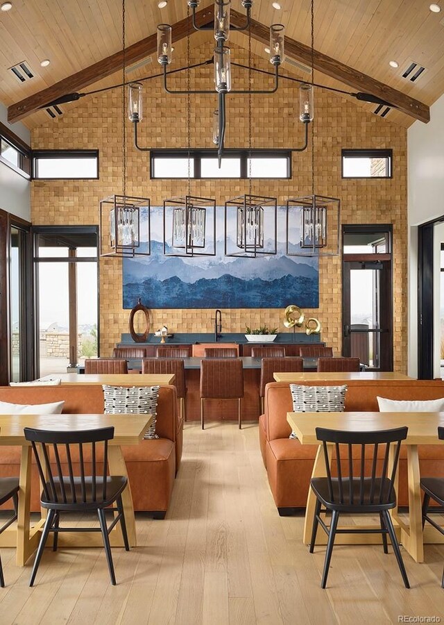 community lobby with brick wall, wood ceiling, and beamed ceiling