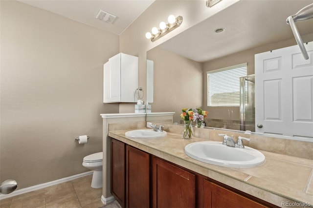 full bathroom with toilet, an enclosed shower, a sink, and tile patterned floors