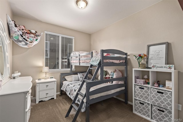 bedroom with carpet and baseboards