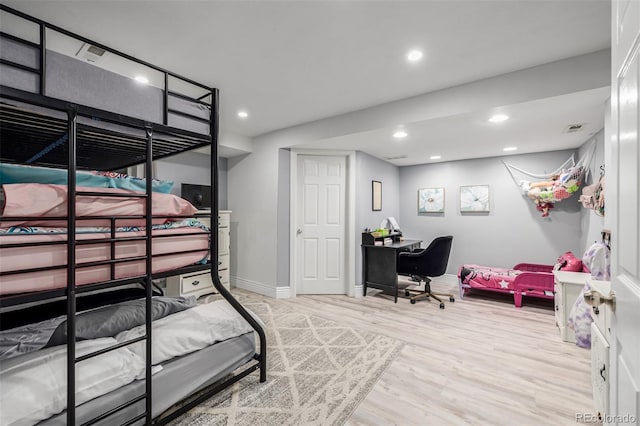 bedroom featuring visible vents, baseboards, wood finished floors, and recessed lighting