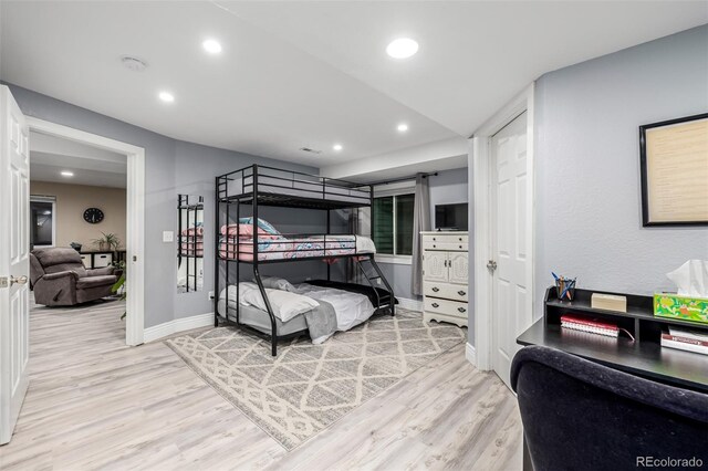 bedroom featuring baseboards, recessed lighting, and light wood-style floors