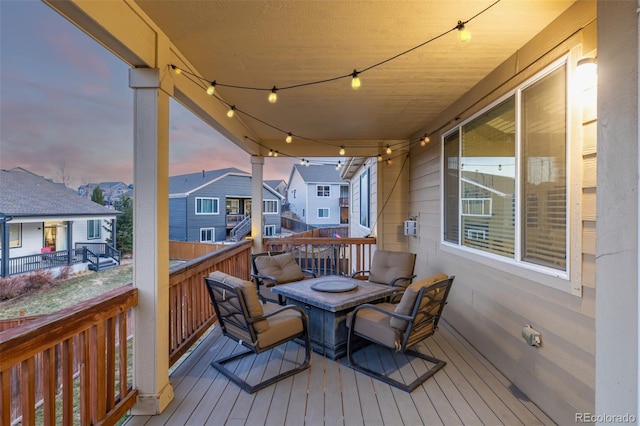 deck at dusk with a residential view