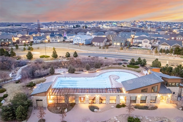 aerial view at dusk with a residential view