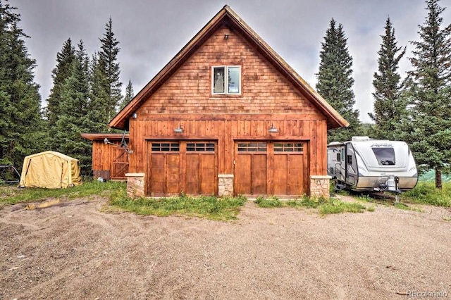 201 Nuthatch Dr, Alma, CO 80420 - view of home's exterior with a garage, an outdoor structure, and board and batten siding