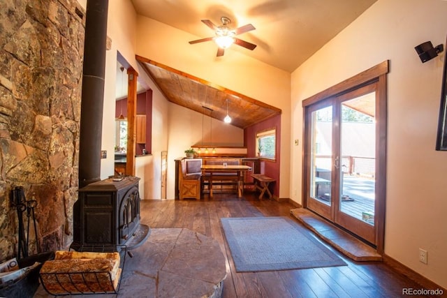 201 Nuthatch Dr, Alma, CO 80420 - living room with a wood stove, hardwood / wood-style floors, vaulted ceiling, and a ceiling fan