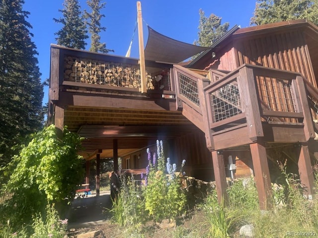 201 Nuthatch Dr, Alma, CO 80420 - rear view of property featuring board and batten siding and a wooden deck