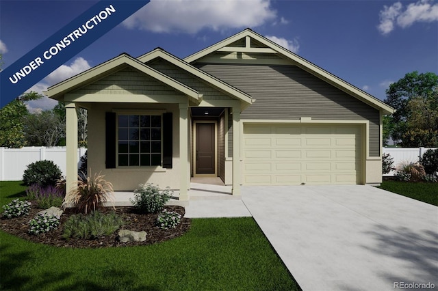 view of front of property featuring a garage and a front lawn