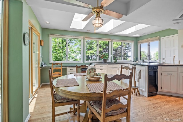 6895 S Norfolk St, Foxfield, CO 80016 - dining room with a skylight, light wood-style floors, a ceiling fan, healthy amount of natural light, and recessed lighting