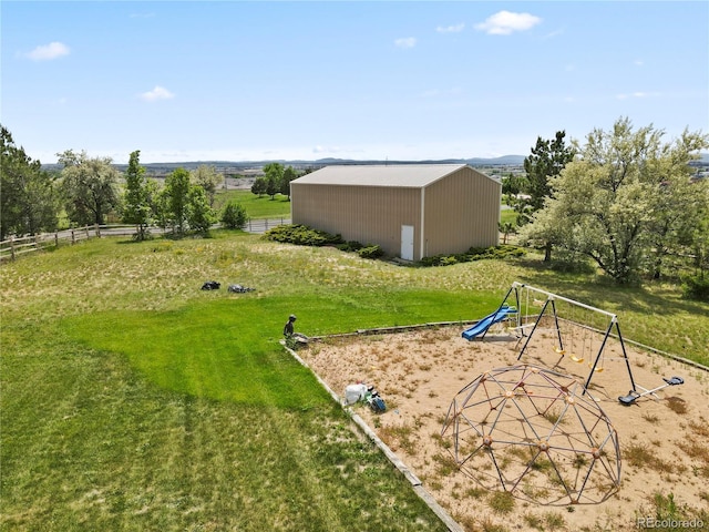 6895 S Norfolk St, Foxfield, CO 80016 - view of yard featuring an outbuilding, a playground, and a rural view
