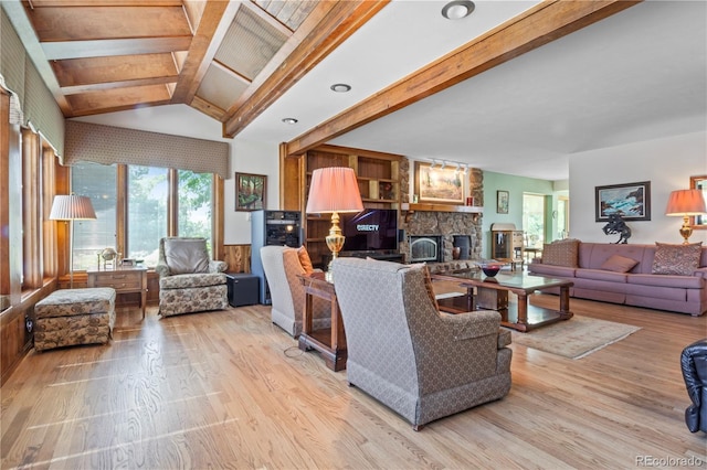 6895 S Norfolk St, Foxfield, CO 80016 - living room featuring light wood-style flooring, plenty of natural light, and a stone fireplace