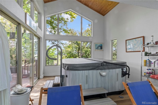 6895 S Norfolk St, Foxfield, CO 80016 - misc room featuring high vaulted ceiling, healthy amount of natural light, and light wood-type flooring