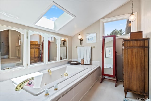 6895 S Norfolk St, Foxfield, CO 80016 - full bath with vaulted ceiling, a skylight, and a jetted tub