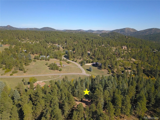 drone / aerial view featuring a mountain view