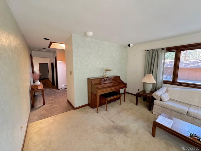 sitting room featuring carpet and a baseboard radiator