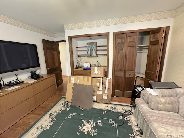 bedroom with hardwood / wood-style floors